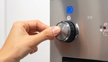 Close-up of hand adjusting stainless steel oven knob with blue-lit digital display, set in a modern kitchen with fruit bowl in background, highlighting smart cooking technology and user interaction.