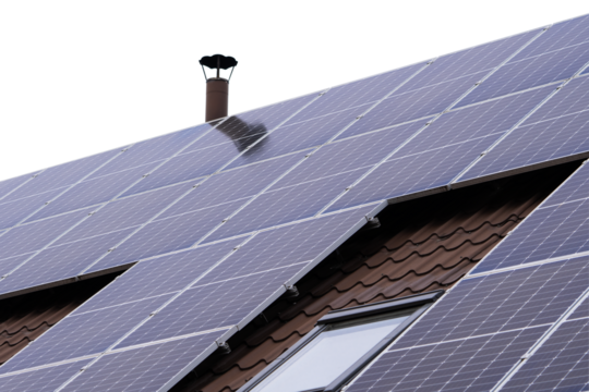 Solar panels on a sloped roof under a clear sky for renewable energy generation