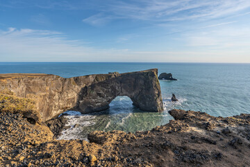 Perched above roaring waves and endless black sands, Dyrhólaey reveals Iceland’s raw beauty.