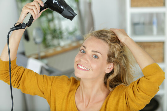 woman drying hair