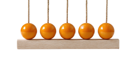 Newton's cradle Five orange spheres are suspended and aligned above a wooden base. Physics concept