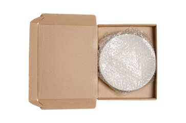 An open cardboard box with bubble wrap. The concept of packaging parcels with fragile cargo. Isolated on white