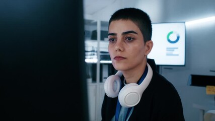Professional, Expert Female Software Engineer sitting at desk, looking at computer screen, hand typing on keyboard, writing code, developing software app, prompt ai machine learning data in office.