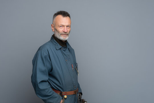 portrait of man with tool exuding skill and focus