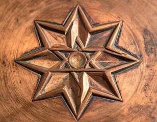 Embossed copper seven-pointed star, centered, weathered, with circular surround