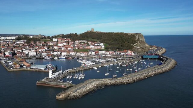 Aerial video of Scarborough North Yorkshire UK.It is located on the North Sea coastline. Historically in the North Riding of Yorkshire, the town lies between 10 and 230 feet (3–70 m) above sea level, 