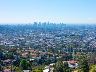 Hazy, wide panoramic view of the Los Angeles downtown skyline.