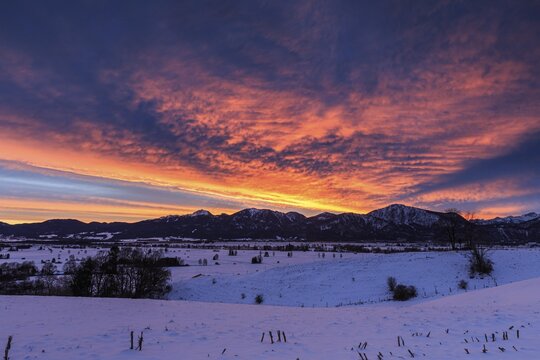 Dawn, clouds over mountains, winter, snow, Loisach-Lake Kochel moor, Kochler mountains behind, Bavaria, Germany