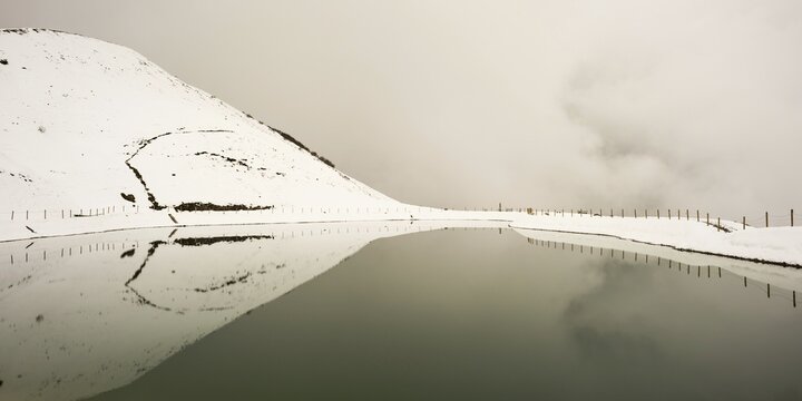 Onset of winter in May, Riezler Alpsee, an artificial lake, snow pond, feeds the snow cannons that provide the slopes of the Fellhorn and Kanzelwand cable cars with snow, Allgäu Alps, Vorarlberg, Austria