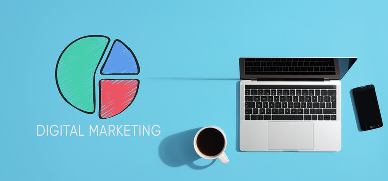 Digital marketing strategy planning with laptop, smartphone and coffee on blue background