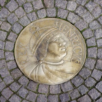 Medallion of the first King of Germany Henry the Fowler embedded in cobbled street, Meissen, Saxony, Germany
