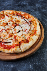 Cheesy Pepperoni Pizza Sliced On A Wooden Board With Tomato Sauce