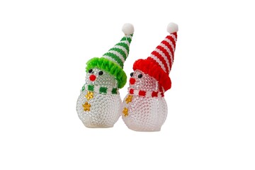 A festive figurine of two snowmen wearing a red and green hat and scarf on a transparent background.