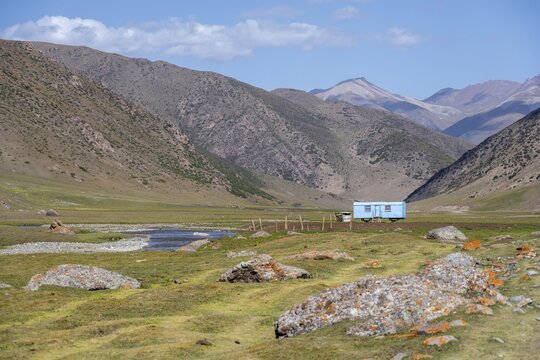 Construction trailer, caravan of Kyrgyz shepherds, mountain landscape in the Karkyra Valley, Karkyra River, Kyrgyzstan