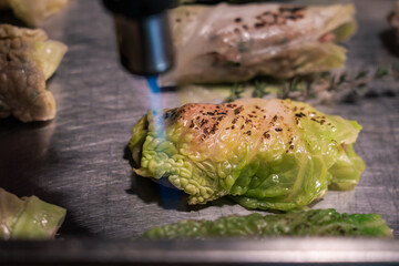 A piece of food is being cooked with a flame