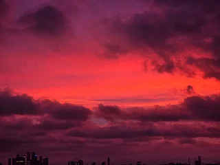 Selbstklebende Fototapeten Hochrot dramatic sky at sunset  © Julia
