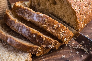 Close up of sliced whole grain bread with visible seeds and grains