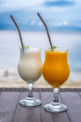 Nusa Penida, Indonesia – Vanilla shake and mango juice served at a beach club by the sea, with a relaxed tropical atmosphere.