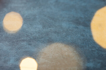 Christmas lights with a bokeh effect on a dark blue background.