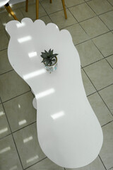 Fototapeta premium Sousse, Tunisia A foot shaped table in a podiatrist office.