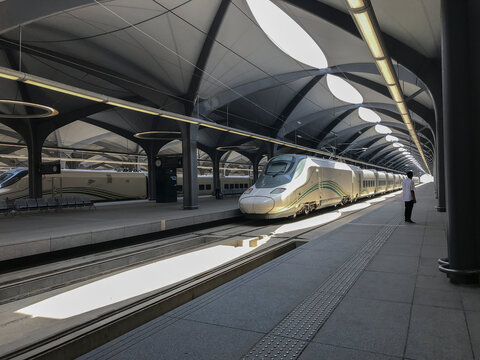 MECCA, KINGDOM SAUDI ARABIA (KSA)- MAY 27, 2019:An unidentified man looks on at HSR High Speed Railway station in Mecca. The train model is Talgo 350SRO manufactured by Spanish company Talgo and Renfe