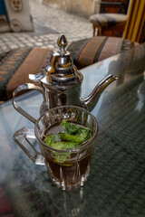Sousse, Tunisia Mint tea served in a silver pot with mint leaves. © Alexander