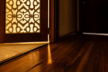Tunis, Tunisia A door to a bathroom left ajar and light.