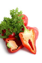 There is a pile of red sweet peppers lying on a white background.	