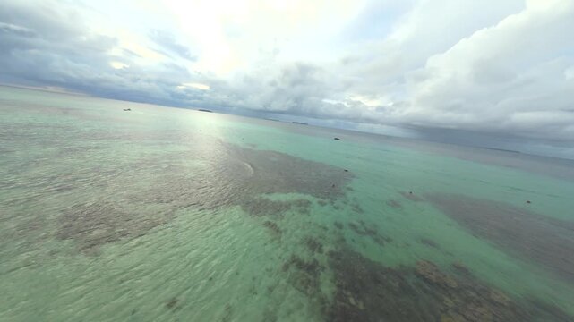 Dynamic FPV Drone Shot Soaring Over Pristine Tropical Beaches and Island Scenery of Karimunjawa