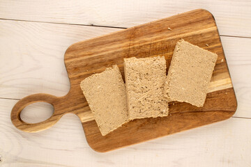 Fragrant sweet halva on the table, top view, macro.