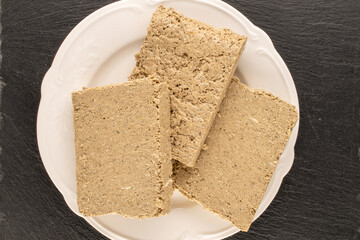 Fragrant sweet halva on the table, top view, macro.