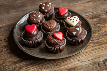 Delicious chocolate heart cupcakes displayed for Valentine's Day, perfect for sharing sweet moments and creating romantic memories, a delightful dessert indulgence