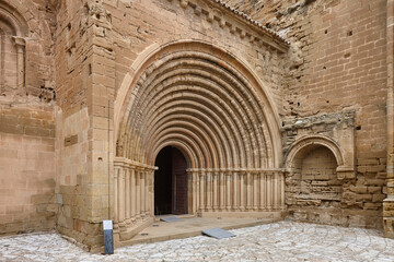 Fototapeta premium Romanesque monastery Santa Maria de Sijena. Semicircular arch entrance. Spain