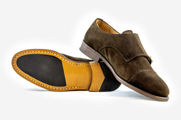 Classic leather shoes in a white background.  Classic brown suede shoe with texture.