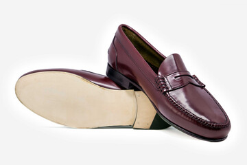 Classic leather shoes in a white background. Moccasins