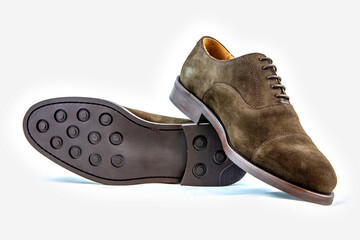 Classic leather shoes in a white background.  Classic brown suede shoe with texture.