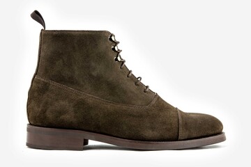 Classic leather shoes in a white background.  Classic brown suede boots.