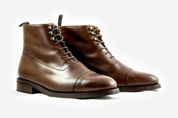 Classic light brown leather shoes in a white background. 