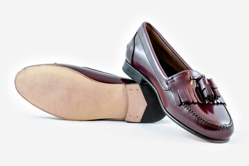 Classic leather shoes in a white background. Black moccasins.