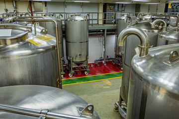 Stainless vertical steel tanks with pressure meter in equipment tank chemical cellar at the with scrolling wheel stainless steel