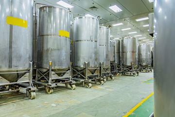 Stainless vertical steel tanks with pressure meter in equipment tank chemical cellar at the with scrolling wheel stainless steel
