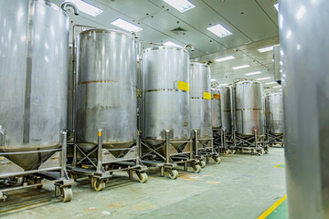 Stainless vertical steel tanks with pressure meter in equipment tank chemical cellar at the with scrolling wheel stainless steel