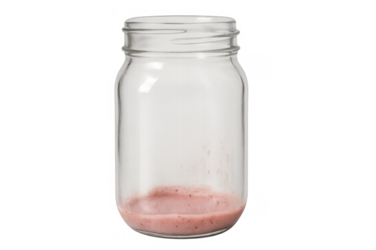 Empty glass jar showing pink smoothie residue at bottom, finishing a healthy drink, transparent background