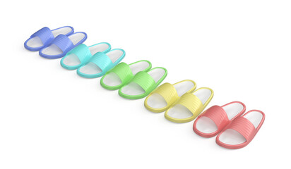 Row of five pairs of rubber slides in different colors on white background