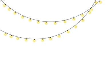 Soft yellow fairy lights glowing in the dark on a black background creating a magical atmosphere