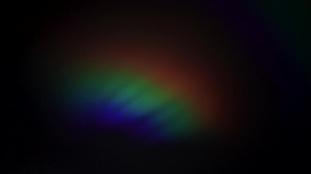 Optical glow of the lens, iridescent light highlights on a black background