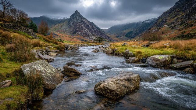 Tranquil waters flowing through Ogwen Valley landscape in Snowdonia National Park, Wales, United Kingdom