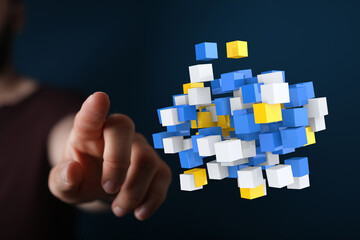 Hand reaching towards a cluster of 3D cubes, symbolizing connection, technology, and innovation. Perfect for da
