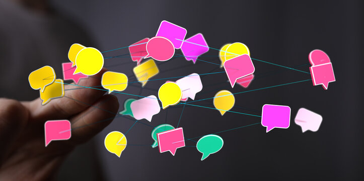 Abstract network of speech bubbles connected to a finger representing communication, social connection and tech