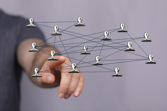 Concept of digital networking, social media, community connections, teamwork, global communication, with human hand touching icons - Powered by Adobe